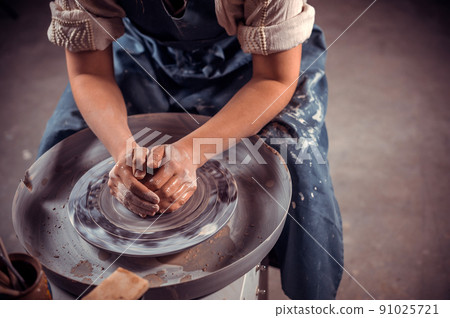 Ceramist master making ceramic pot on the pottery wheel . Close-up. Ceramist master making ceramic pot on the pottery wheel . Close-up. 91025721