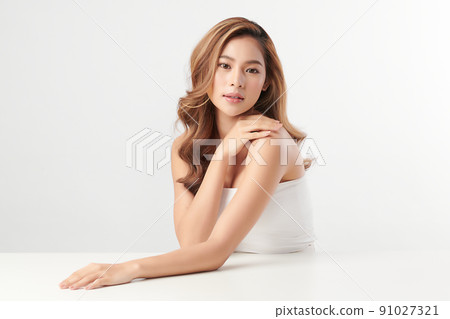 Beautiful young asian woman with clean fresh skin on white background, Face care, Facial treatment, Cosmetology, beauty and spa, Asian women portrait. 91027321