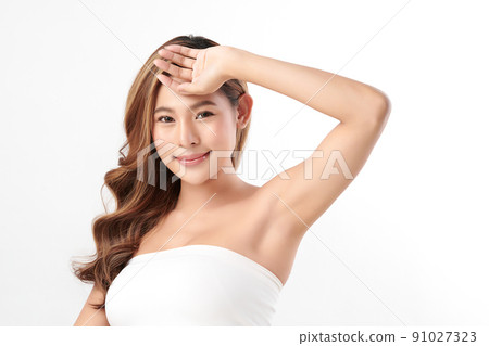Beautiful Young Asian woman lifting hands up to show off clean and hygienic armpits or underarms on white background, Smooth armpit cleanliness and protection concept Beautiful Young Asian woman lifting hands up to show off clean and hygienic armpits or underarms on white background, Smooth armpit cleanliness and protection concept 91027323