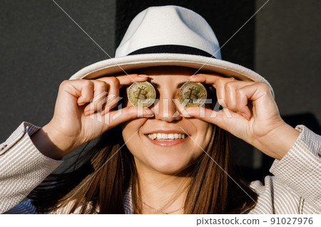 Beautiful girl in glasses from bitcoin. Bitcoin cryptocurrency. Sexy woman with bitcoin isolated on outdoor. Bull market. 91027976