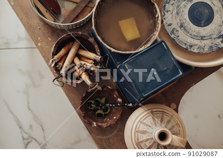 Flat Lay of Pottery Master Accessories, Potter Tools in the Ceramic Studio 91029087