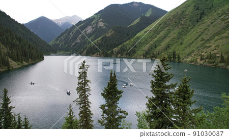 Kolsai mountain lake and green forest. Top view. Kolsai mountain lake and green forest. Top view. 91030087