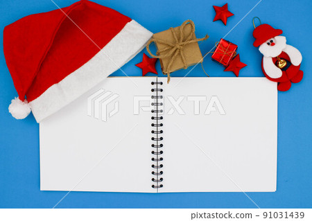 Notebook and box on the blue background. 91031439