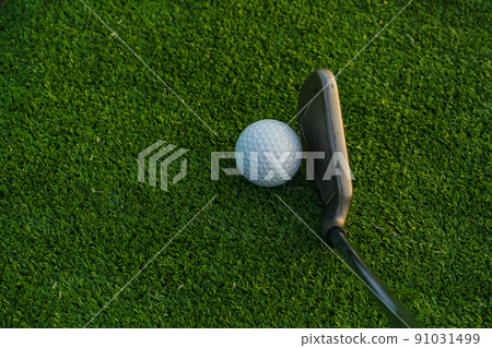 Golf balls on the golf course with golf clubs ready for golf in the first short. Golf balls on the golf course with golf clubs ready for golf in the first short. 91031499