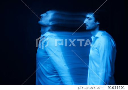 blurred silhouette of ghost man's soul on a dark background 91031601