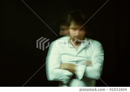 schizophrenic portrait of a psychopathic man with mental disorders in a white shirt 91031604