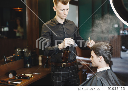 Man work with hair. Hairdresser with a client. Man work with hair. Hairdresser with a client. 91032433
