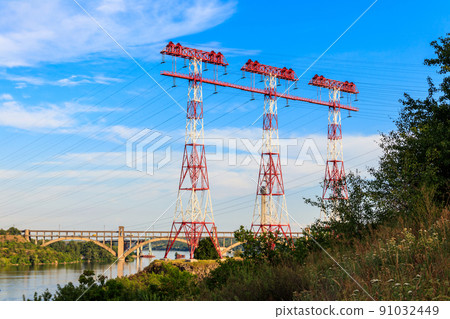 High voltage power line across the Dnieper river on Khortytsia island in Zaporizhia, Ukraine 91032449
