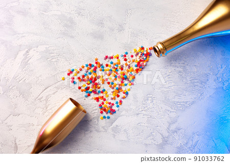 Champagne bottle with confetti flat lay top view Champagne bottle with confetti flat lay top view 91033762