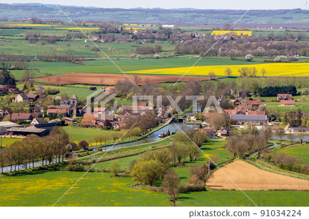 France, aerial view of Chateauneuf en Auxois village and Vandenesse canal 91034224