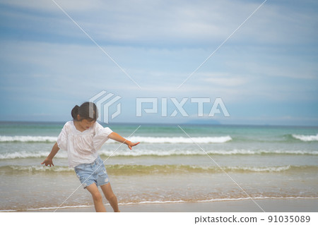 Children playing in the sea Children playing in the sea 91035089