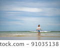 Children playing in the sea 91035138