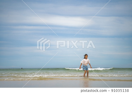 Children playing in the sea Children playing in the sea 91035138