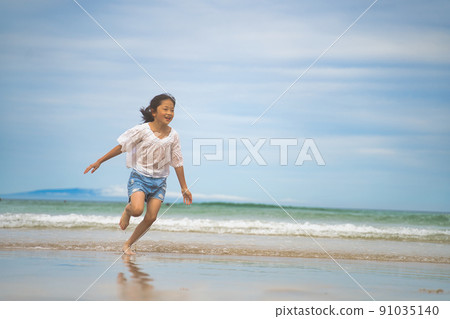 Children playing in the sea Children playing in the sea 91035140