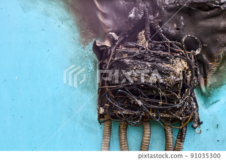 Electrical fire after short circuit in consumer unit, burnt wiring and circuit breakers in switchboard. 91035300