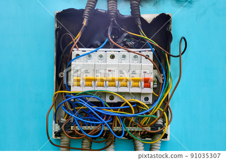 After an electrical fire, domestic consumer unit wiring was burned. After an electrical fire, domestic consumer unit wiring was burned. 91035307
