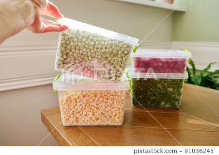 Frozen vegetables and fruits, close-up frozen green onions, peas, cherry, corn 91036245