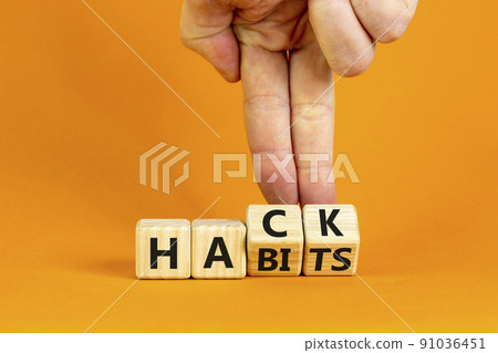 Hack habits symbol. Doctor turns wooden cubes with words 'Hack habits'. Beautiful orange table, orange background. Psychology, hack habits concept. Copy space. Hack habits symbol. Doctor turns wooden cubes with words 'Hack habits'. Beautiful orange table, orange background. Psychology, hack habits concept. Copy space. 91036451