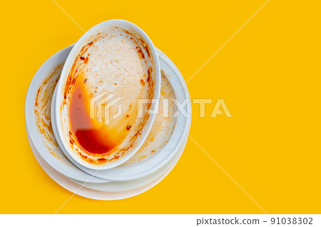 Dirty dishes on yellow background. Top view Dirty dishes on yellow background. Top view 91038302