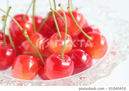 Cherry served on a glass plate in early summer Cherry served on a glass plate in early summer 91040458