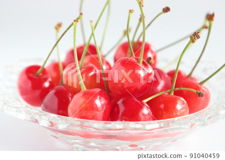 Cherry served on a glass plate in early summer Cherry served on a glass plate in early summer 91040459