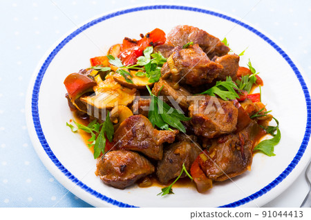Stewed meat with vegetables and mushrooms 91044413