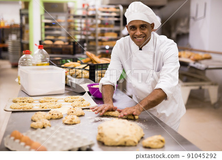 Making sweet buns and eggs in bakery kitchen Making sweet buns and eggs in bakery kitchen 91045292