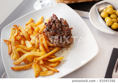 Beef flank steak with chimichurri sauce Beef flank steak with chimichurri sauce 91045398