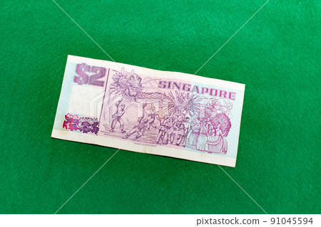 Singapore dollar on green background, 2 dollar bill 91045594