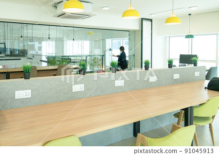 Co working space with working desks and chairs. Co working space with working desks and chairs. 91045913