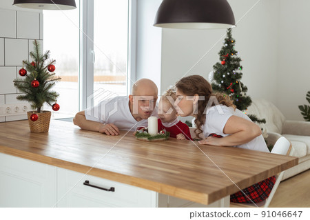 Baby child with hearing aid and cochlear implant having fun with parents in christmas room. Deaf , diversity and health concept 91046647