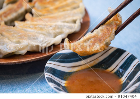 Japanese grilled dumplings and miso sauce. 91047404