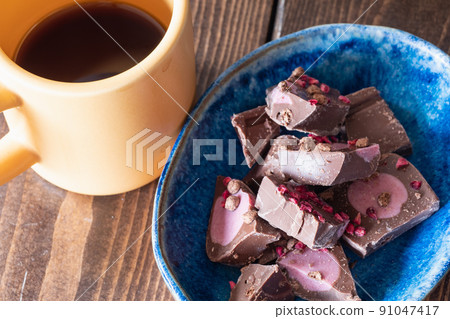 Milk chocolate and hot coffee mixed with berries. Milk chocolate and hot coffee mixed with berries. 91047417