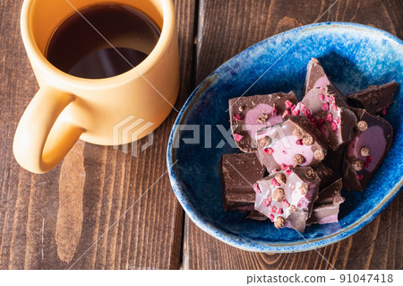 Milk chocolate and hot coffee mixed with berries. Milk chocolate and hot coffee mixed with berries. 91047418