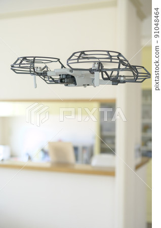 Drone flying indoors Drone flying indoors 91048464