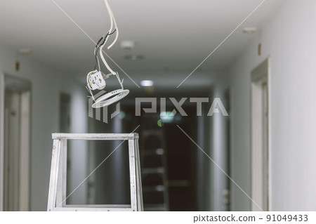install replace fix or repair ceiling down lights bulb danger area with electrical shock concept. 91049433