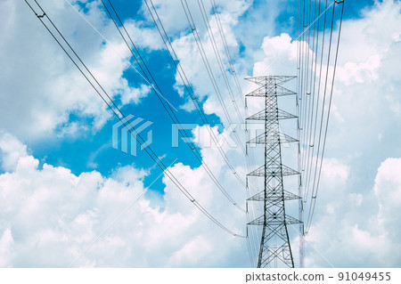 Electric Pole power line against blue sky, electricity post high voltage tower power transport to city urban area 91049455