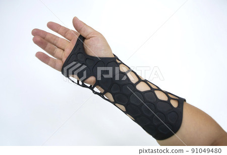 Orthopedic plastic prosthesis printed on powder 3D printer on hand isolated on white background. Gypsum close-up. Multi Jet Fusion MJF 3D printing technology. Modern progressive additive technology. Orthopedic plastic prosthesis printed on powder 3D printer on hand isolated on white background. Gypsum close-up. Multi Jet Fusion MJF 3D printing technology. Modern progressive additive technology. 91049480