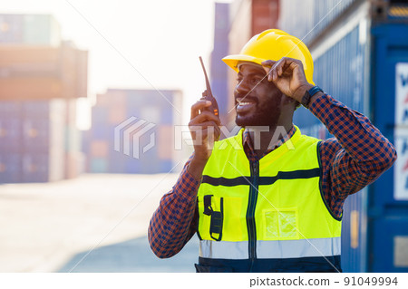 black worker African working engineer foreman radio control in port cargo shipping customs container yard black worker African working engineer foreman radio control in port cargo shipping customs container yard 91049994
