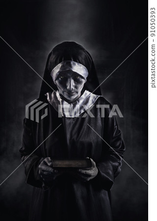 Horror Scene of a Possessed nun Woman ghost halloween in dark room Horror Scene of a Possessed nun Woman ghost halloween in dark room 91050393