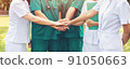 hands together between the doctor and nurses 91050663