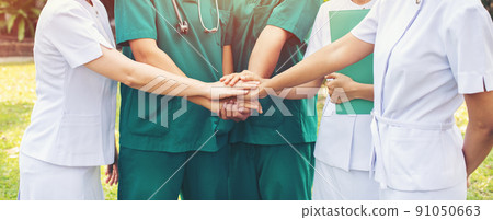 hands together between the doctor and nurses 91050663