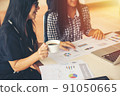 Two young asia business woman working together in office space 91050665