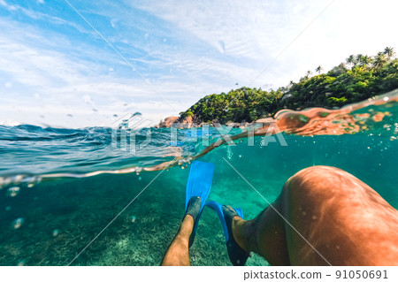 Tropical Island Palm and underwater, Snorkeling in the sea 91050691