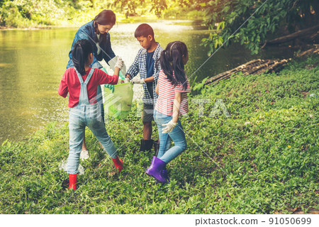 Group of kids and teacher school volunteer charity environment. Group of kids and teacher school volunteer charity environment. 91050699