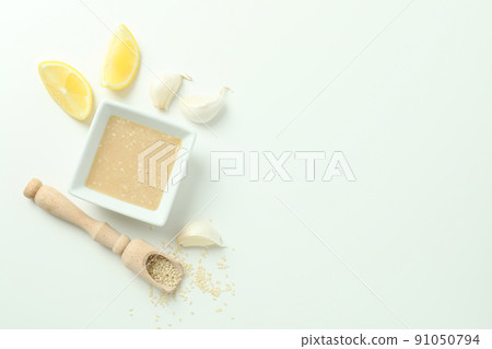 Concept of tasty food with tahini sauce on white background Concept of tasty food with tahini sauce on white background 91050794