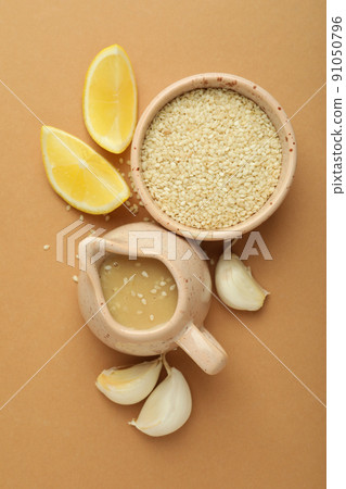 Concept of tasty food with tahini sauce on beige background 91050796