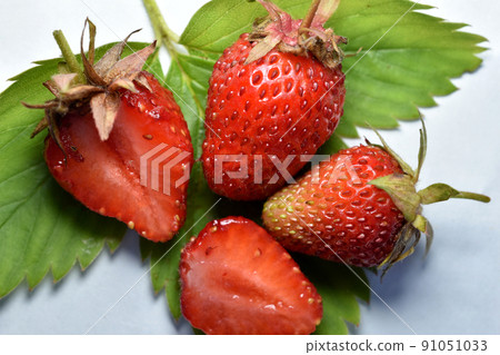 Ripe strawberries on a white table. Ripe strawberries on a white table. 91051033