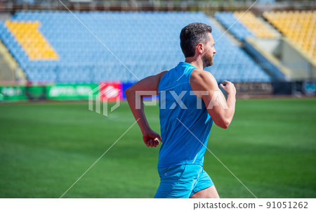 man running on stadium. fitness gym outdoor.  91051262
