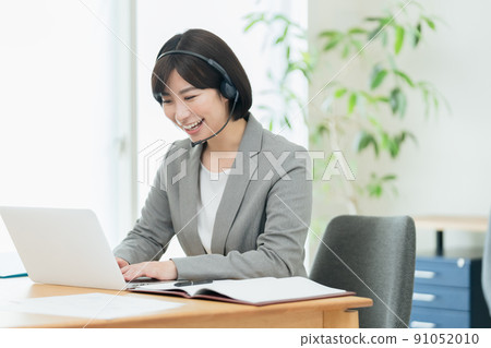 Businesswoman having an online meeting Businesswoman having an online meeting 91052010